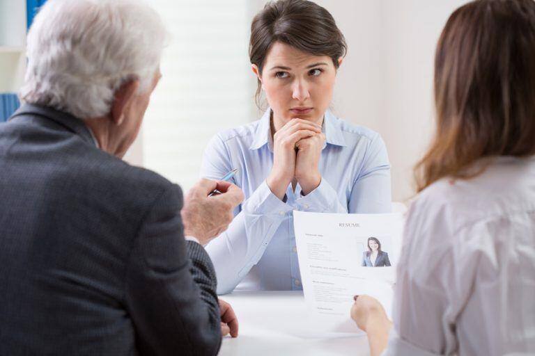 woman being interviewed by man and woman